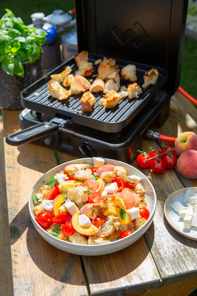 Peach and Feta salad with toasted croutons, tomatoes and basil made on a Cadac grill 
