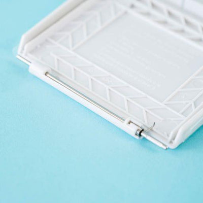 A white Dethleffs motorhome external gas BBQ point cover.