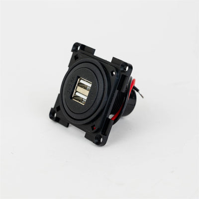 A black Dethleffs motorhome USB socket.