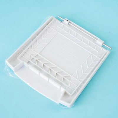 A white Dethleffs motorhome external gas BBQ point cover.