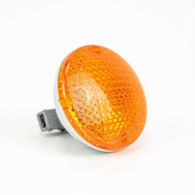 An orange Roller Team motorhome rear indicator light.