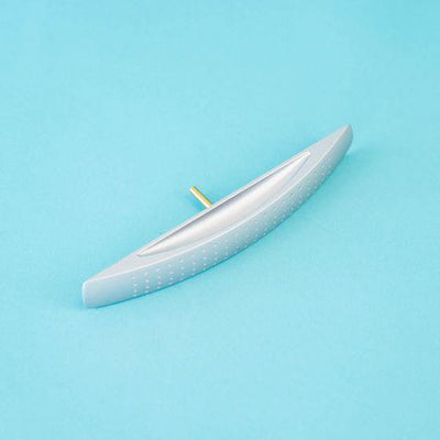 A silver arch-shaped Roller Team motorhome cupboard door handle.