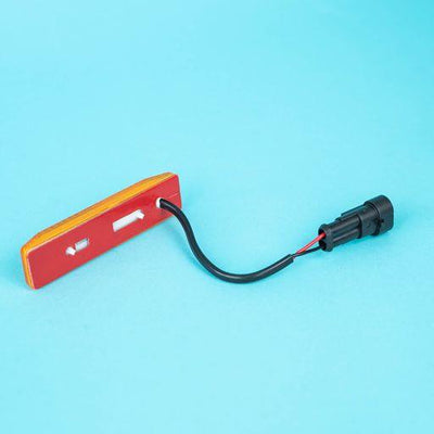 A rectangular amber Dethleffs motorhome side marker light.
