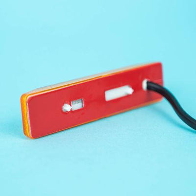 A rectangular amber Dethleffs motorhome side marker light.