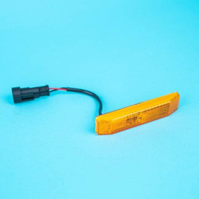 A rectangular amber Dethleffs motorhome side marker light.