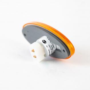 An orange Dethleffs motorhome side marker light.