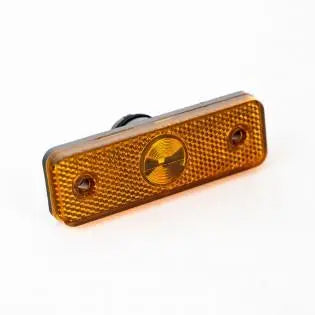 An amber Roller Team motorhome rectangular side marker light.