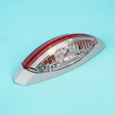 A red Dethleffs motorhome nearside side marker light.