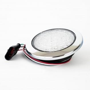 A clear Roller Team motorhome reverse light with a chrome bezel.